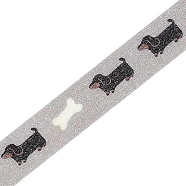 Gray ribbon with black dog illustrations and a white bone on a white background