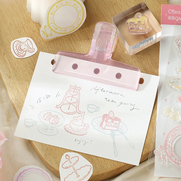 Clear stamps with cute designs on a wooden surface