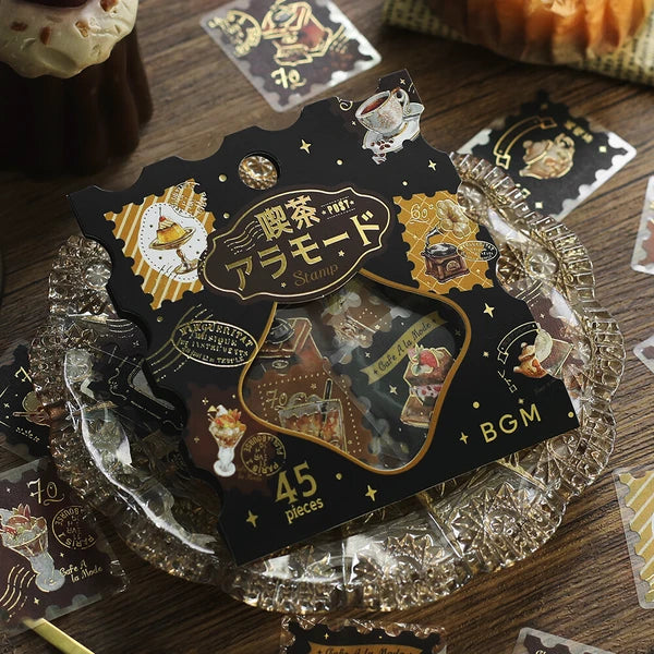 Decorative sticker pack with intricate designs on a wooden surface