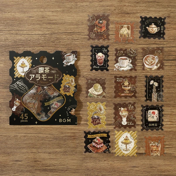 Collection of decorative stickers with vintage coffee-themed designs on a wooden surface.