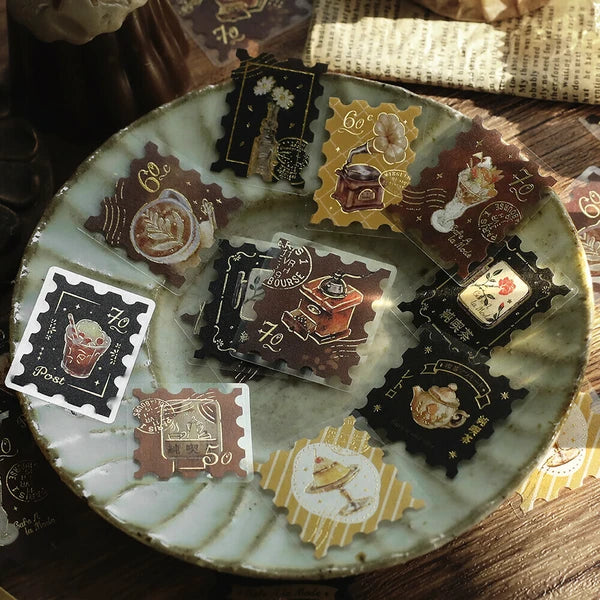 Collection of vintage-style postage stamps on a decorative plate.