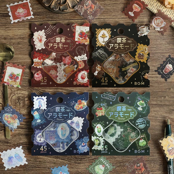 Four packages of decorative stickers with various designs on a wooden surface.