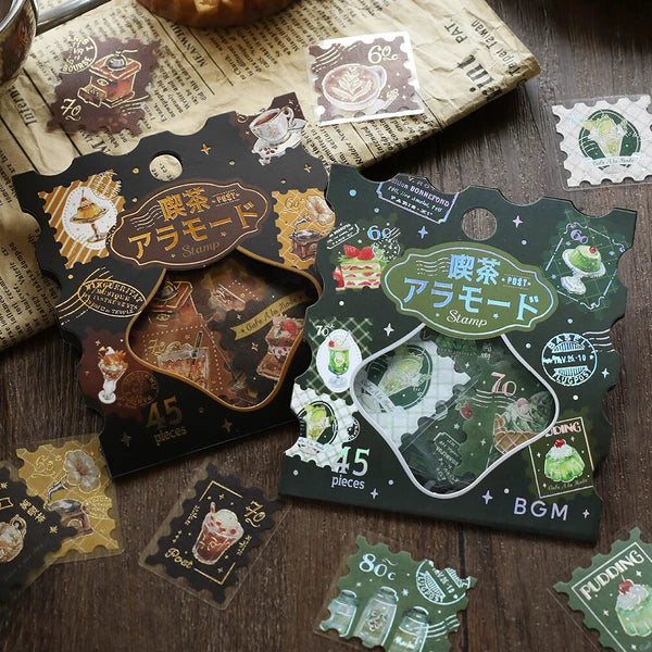 Decorative sticker sheets with vintage coffee-themed designs on a wooden surface.