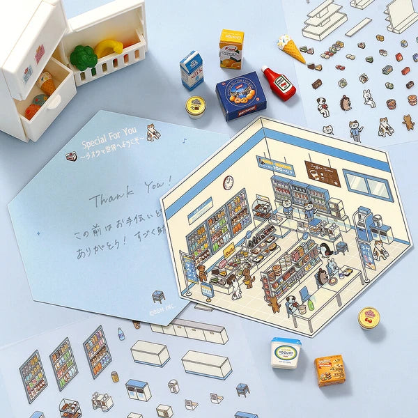 Miniature model of a store with various small items on a light blue background