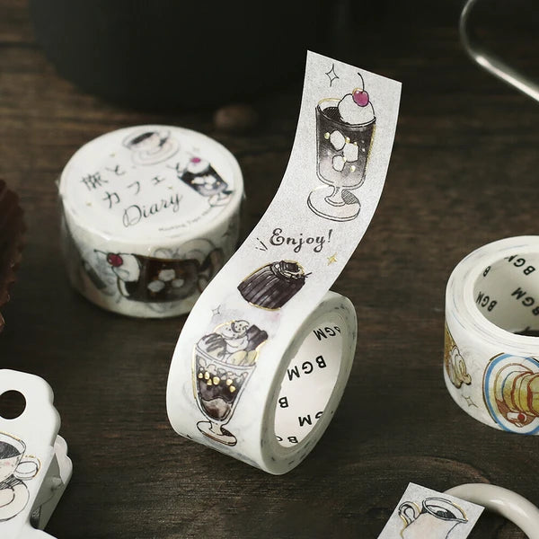 Decorative tape with coffee-themed design on a wooden surface