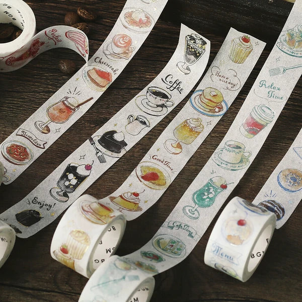 Decorative tape with coffee and dessert designs on a wooden surface
