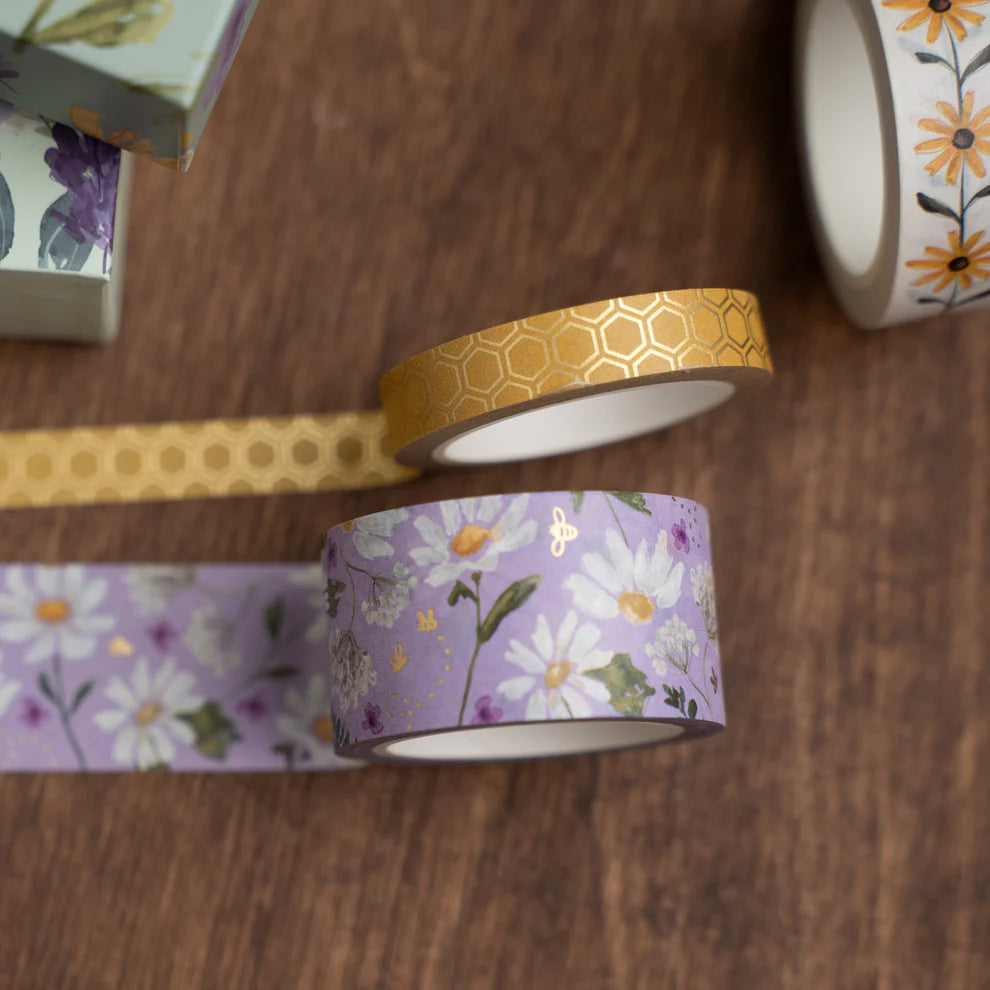 Washi tape with floral and geometric designs on a wooden surface. June Quarterly Box Beekeeper’s Garden from Archer & Olive.